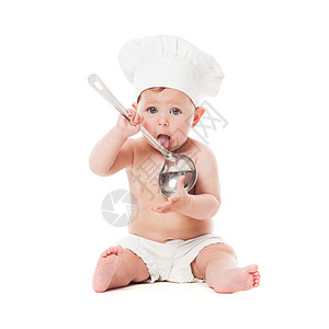 可爱的婴儿用金属勺子厨师帽隔离白色小厨师图片