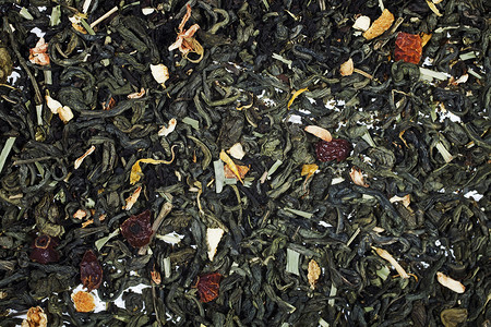质地干燥的绿茶与花瓣的花果紧密相连草本植物高清图片素材