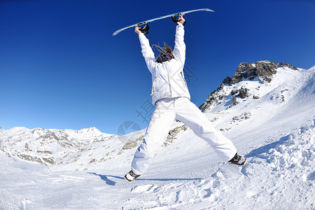 冬季妇女滑雪运动乐趣旅游雪板图片