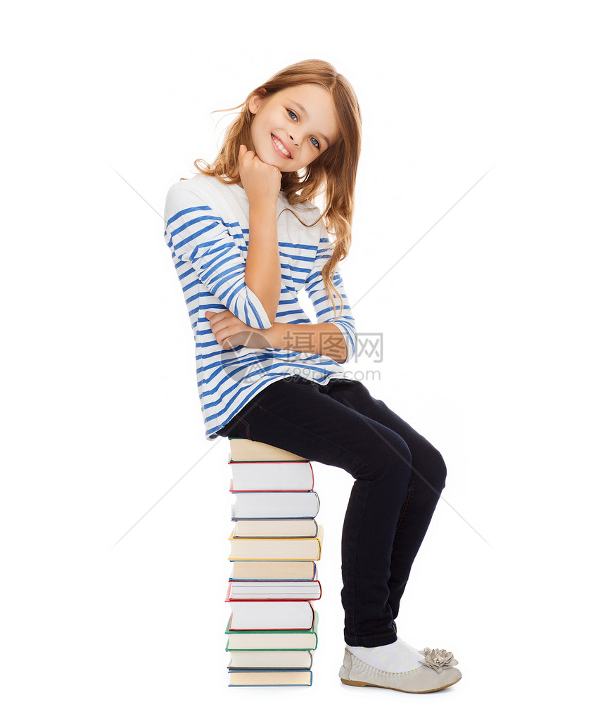 教育学校小学生女孩坐堆书上图片