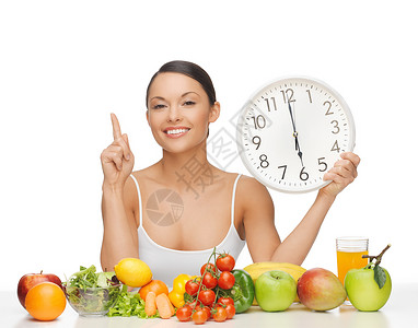 六点钟饮食后快乐的女人吃水果蔬菜图片