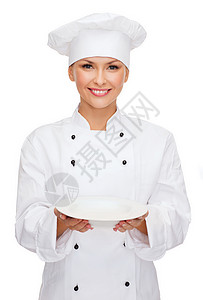 烹饪食物微笑的女厨师,厨师包师与空盘图片