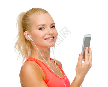运动,健身,技术,互联网医疗保健微笑的运动女与智能手机耳机图片