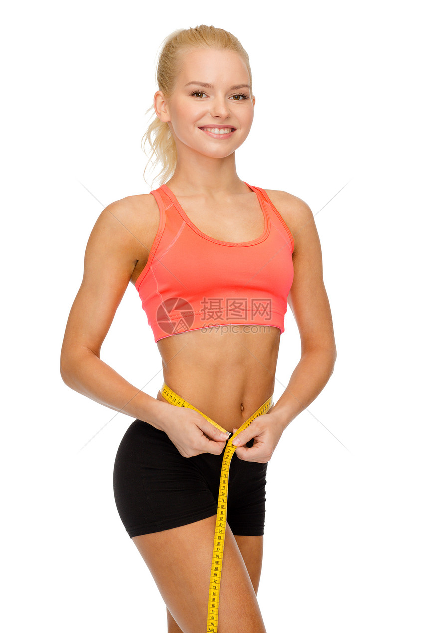 饮食,运动,健身健康的微笑美丽的运动妇女与测量磁带图片