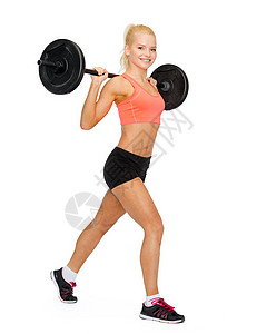 健身,运动运动微笑的运动妇女与杠铃分裂蹲弓步高清图片