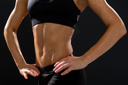 健身饮食美丽的运动女腹肌运动服背景图片