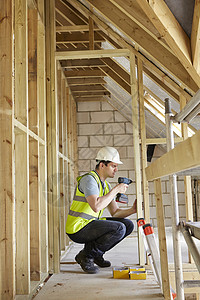 建筑工人房屋建筑上用钻图片