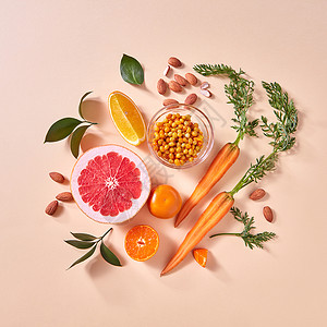 健康素食橙色机蔬菜水果的纸张背景的风景机天然素食的天然机柑橘类水果,胡萝卜,沙棘浆果黄纸背景下制背景图片