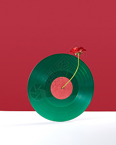 种绿色的复古乙烯基唱片,装饰双红白色背景上,文字的红花的成,装饰乙烯基音频记录个双白色红色背景与背景图片
