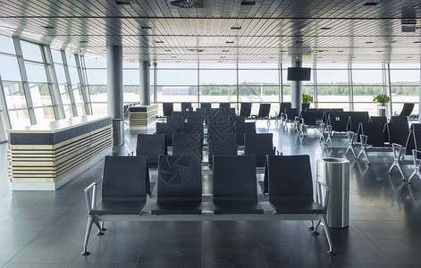 现代机场航站楼,配空扶手椅,供等待飞旅行运输机场空候候厅,休息区图片