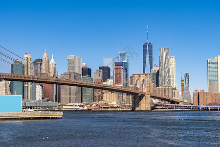 布鲁克林桥与曼哈顿下城摩天大楼为纽约市纽约州,美国东高清图片素材