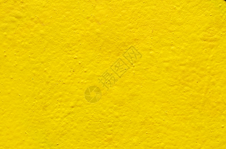 水泥墙上的黄色背景图像图片
