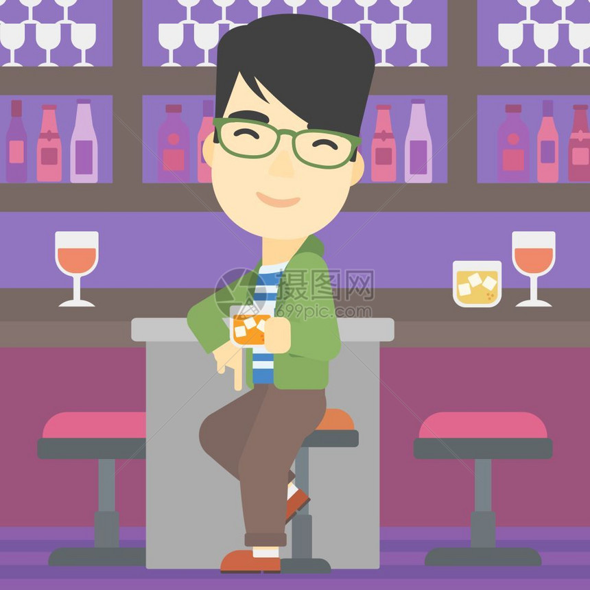 坐在酒吧柜台喝酒的男人图片