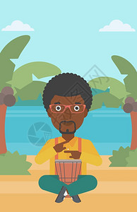 一名非洲美国人在热带海滩背景上演奏手鼓图片