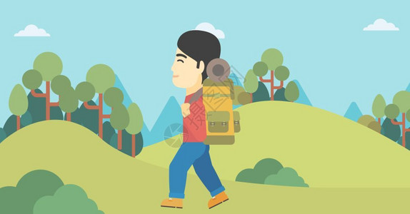 一个在山上徒步的背包客图片