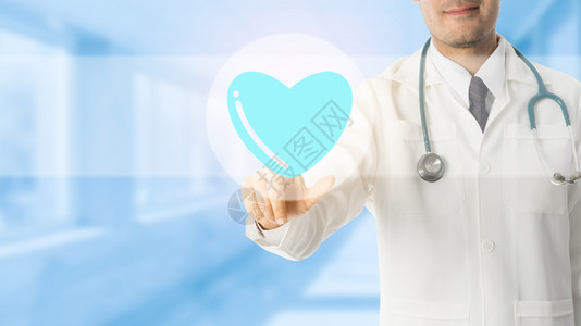 医生指向蓝色院背景的心脏符号图标医疗和概念图片