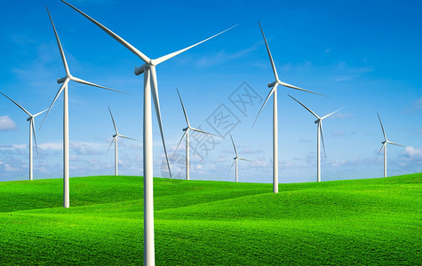 绿色草地上可再生清洁能源风力涡轮机图片