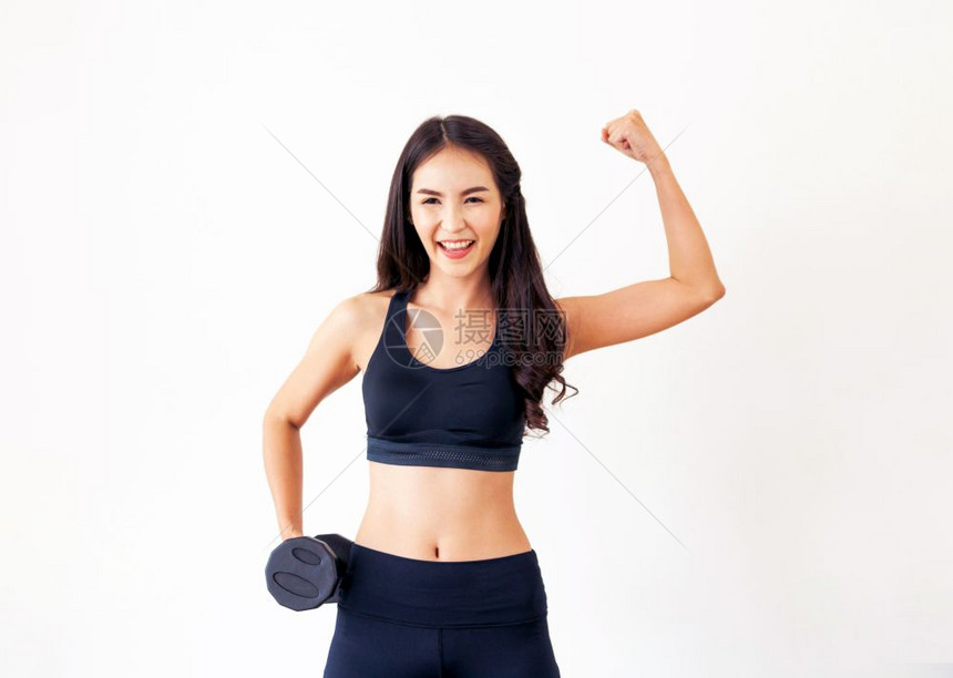 运动妇女与哑铃一起锻炼熟悉背景健康的生活方式和锻炼图片