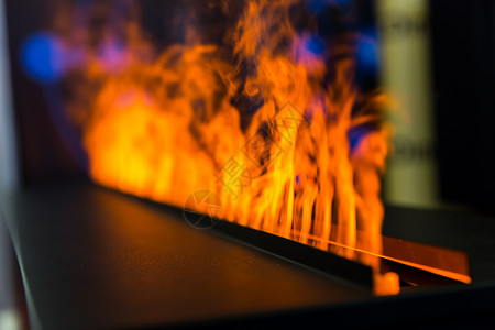 橙色火焰装饰燃气壁炉的火焰背景
