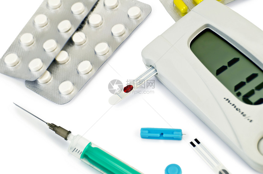 用测试条片和胶囊测量血糖的灰色仪器用包针筒白底隔离头测量血糖图片