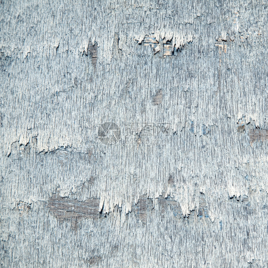 抽象背景由用旧蓝色涂料制成的风化板构图片