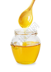 一罐黄色的蜂蜜图片