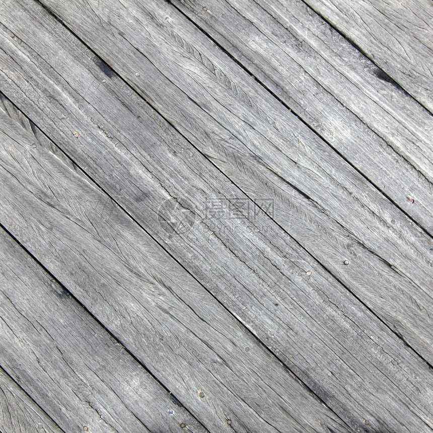 灰色木板有裂缝的对角放置图片