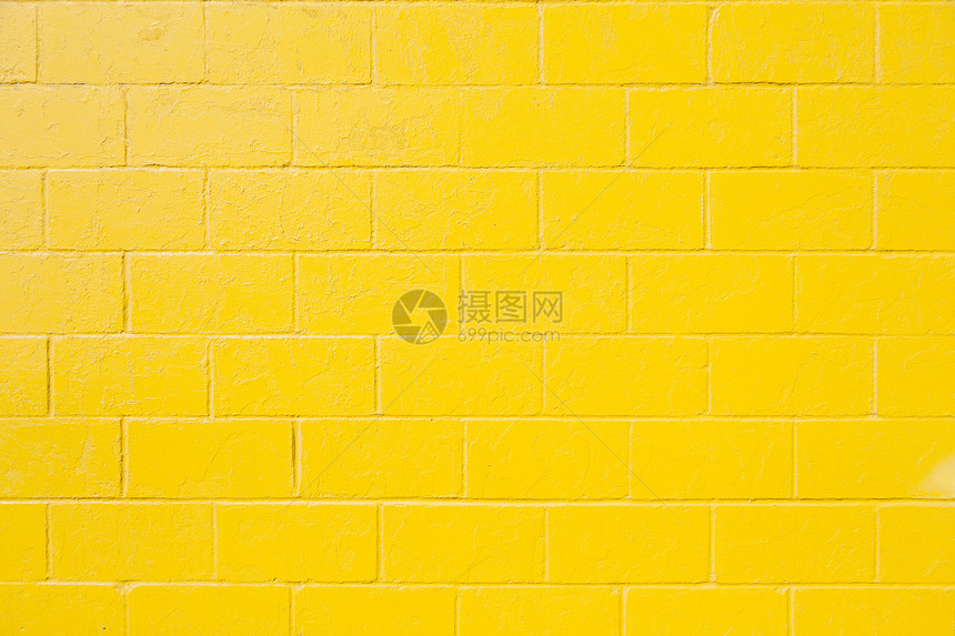 亮黄色油漆砖块墙水平部分图片