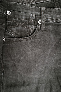 黑色牛仔裤口袋纹理背景带有复制空间的顶视图图片