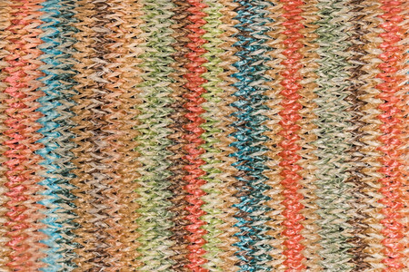 编织纹带有多彩针纹的编织草理背景背景