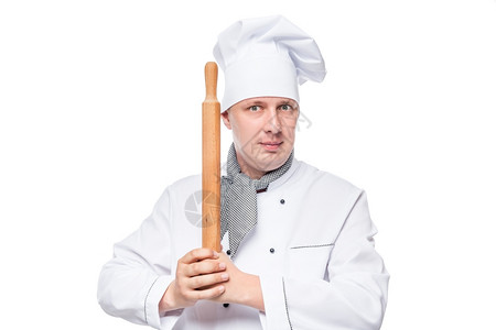 白色背景上手持木制滚针的厨师肖像图片