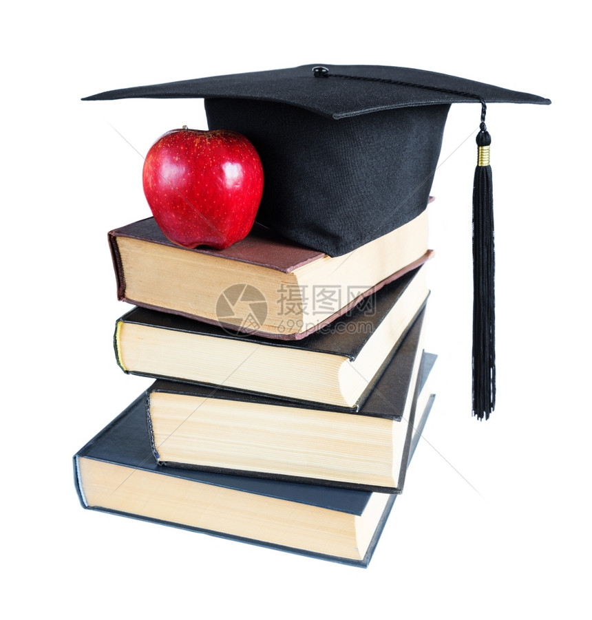 黑色毕业帽子一叠大书和红苹果白背景孤立图片