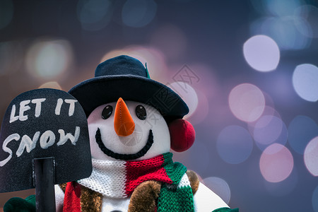 雪人站在冬天的圣诞节快乐和新年迎接冬天的布基背景图片
