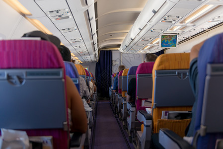 安静乘客飞机上坐着安静的乘客们背景