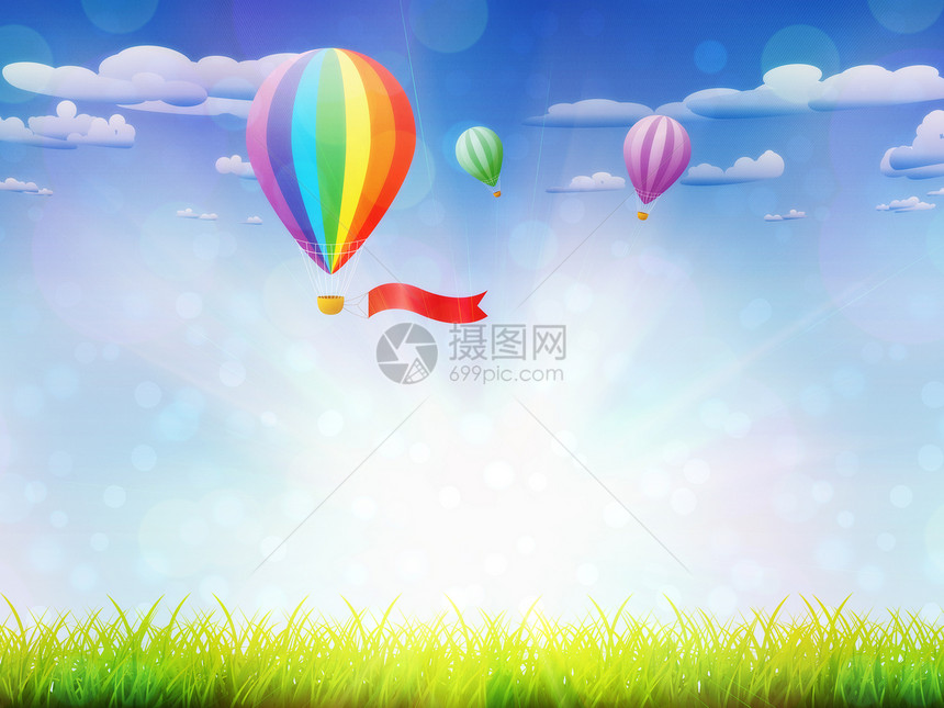 天空背景的新鲜绿草和热气球地上的热气球图片
