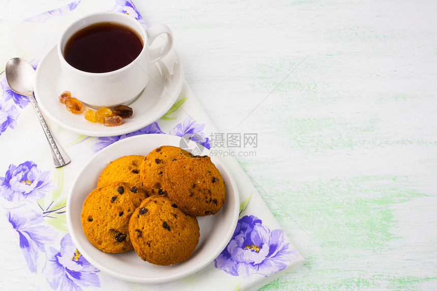 茶杯和饼干淡绿色背景复制空间茶杯晚宴早餐茶家制饼干茶杯和浅绿色背景图片