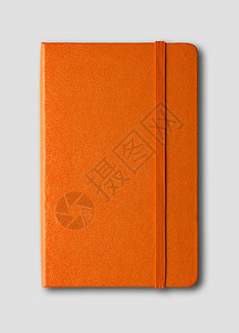 橙色关闭笔记本模型在灰色上隔离橙关闭笔记本在灰色上隔离图片
