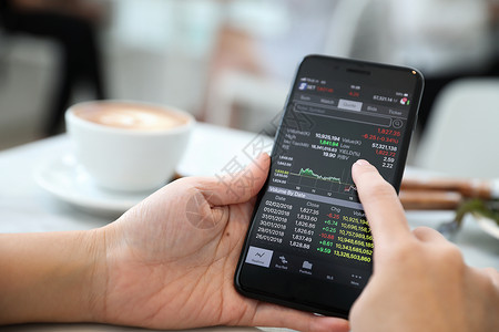 咖啡店在线智能手机交易股商业概念电话高清图片素材