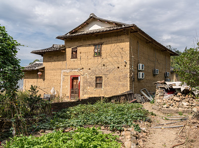 在Xiamen附近的usco遗产地在石屋周围种植茶叶树在Wanuesco世界遗产地外的石屋背景图片