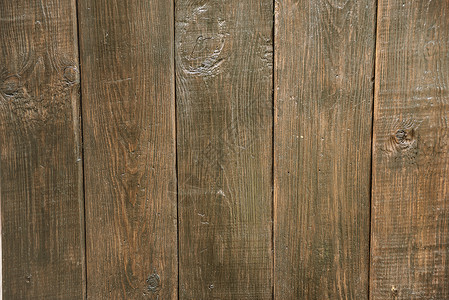 黑木垂直纹理古老的黑木底旧棕色质的表面背景