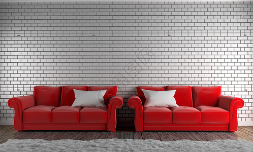 红色沙发和枕头地毯空砖墙上的木地板图片
