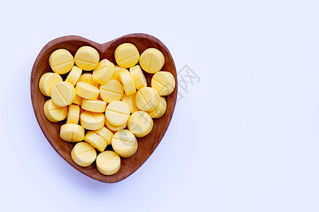 白色背景上的黄抗白甲胺醇药片图片
