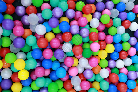 多彩糖果球儿童游戏场上有许多彩的塑料球背景