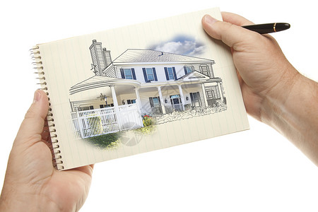 男手拿着笔和纸板用房子在白色背景上被孤立图片