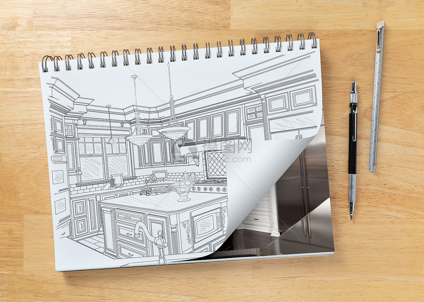桌上的草图垫画着自订厨房和页面角的图纸转弯以显示工程铅笔和标尺的边上已完成施工图片