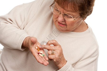 高龄妇女生病·吃药丸背景图片