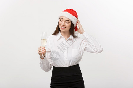 圣诞庆典年轻美丽的商业女人庆祝圣诞节香槟玻璃高清图片素材