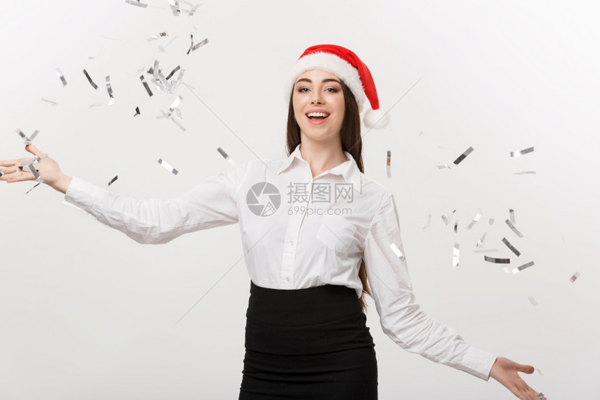 庆祝圣诞节的概念年轻商业妇女为庆祝白种背景孤立的圣诞节图片