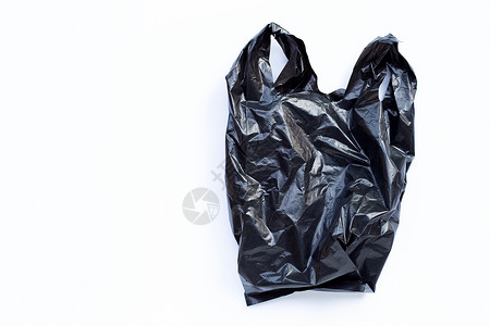 白色背景的黑塑料袋复制空间背景图片