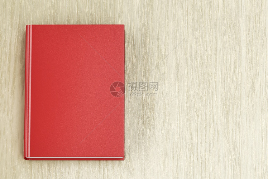 木制桌上的红色书顶视图图片